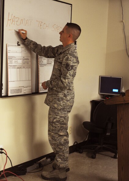 Staff Sgt. Kelby Mier, 7th Logistics Readiness Squadron, Hazmat Tech specialist instructor, prepares notes for the class Oct.27, 2011, at Dyess Air Force Base, Texas. The course is designed for individuals who are hand selected from their squadron to gain authorization to sign-off on hazardous materials. (U.S. Air Force Photo by Airman 1st Class Cierra Bullock/ Released)