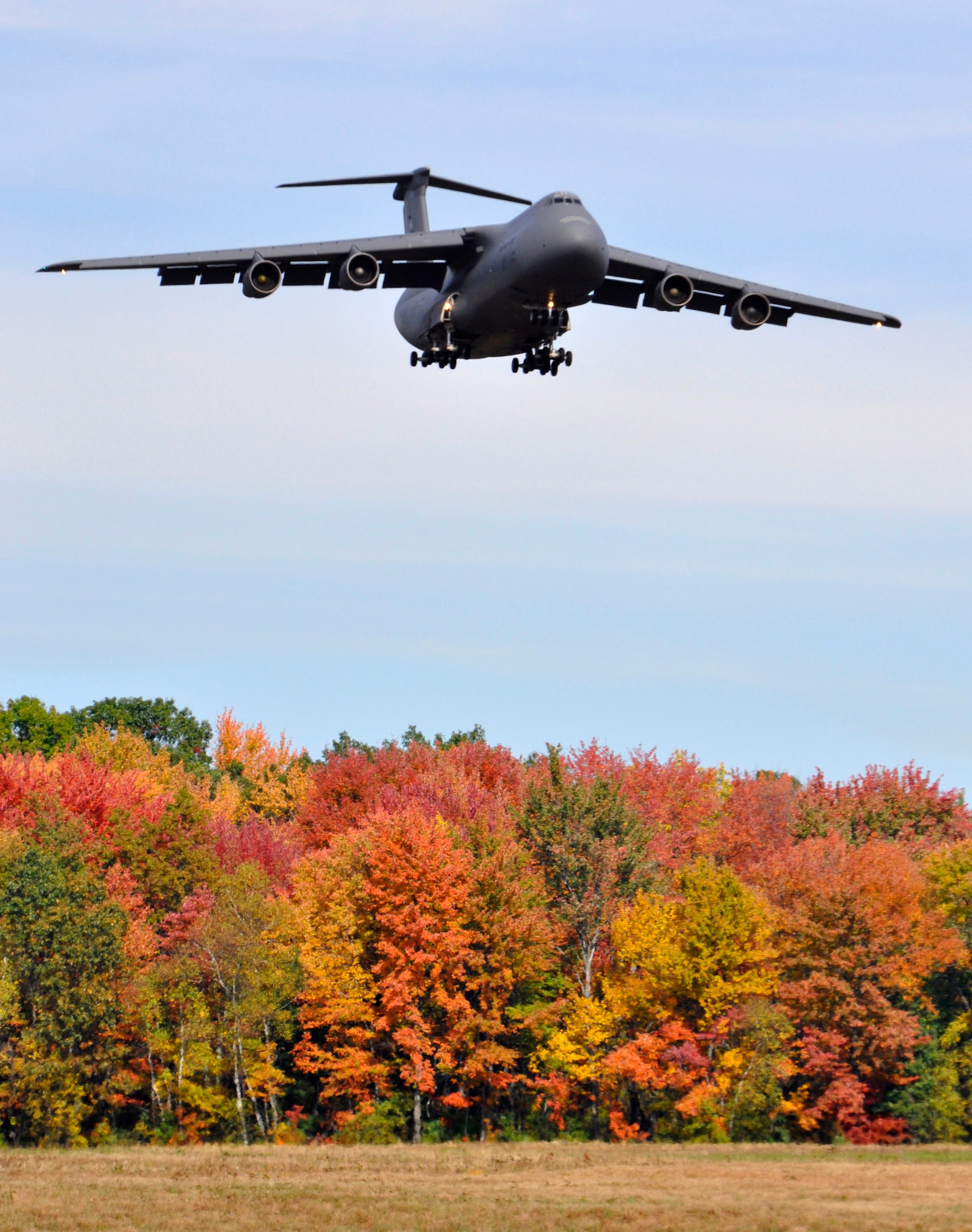 A C-5 Galaxy approaches Westover for landing over fall foliage colors on October 11, 2011. Six of Westover's C-5 transport jets and air crews with Westover's 337th Airlift Squadron participated in an Air Force-wide surge from October 17 to 21. (U.S. Air Force photo/SrA. Kelly Galloway)