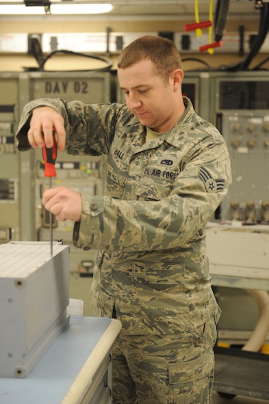 Senior Airman Andrew Hall does a pre-inspection on a line replaceable unit Oct. 27, 2011, at Dyess Air Force Base, Texas. 7 CMS provides a qualified work force to support the wing's global power and the 317th Airlift Group's global reach airlift missions. (U.S.  Air Force photo by Airman 1st Class Cierra Bullock/Released)