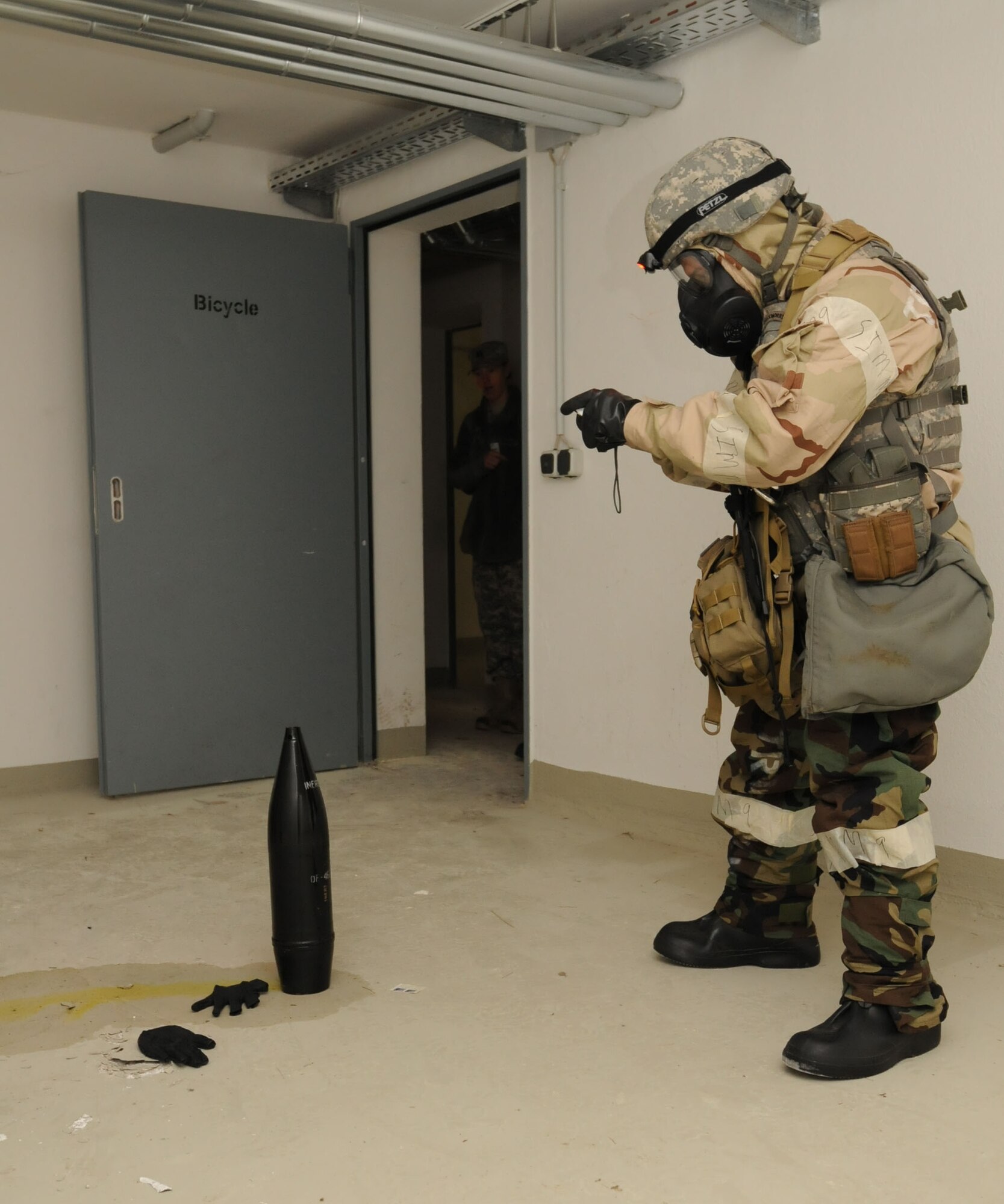 Air Force Senior Airman Christopher Barajas, 886th Explosive Ordnance Disposal Flight, gathers photographic intel during a joint agent response exercise, Ramstein Air Base, Germany, Oct. 27, 2011. The exercise, designed to educate and train U.S. Air Force and Army servicemembers from six emergency response agencies, provided the skills needed for a real world response. (U.S. Air Force photo by Airman 1st Class Kendra Alba)