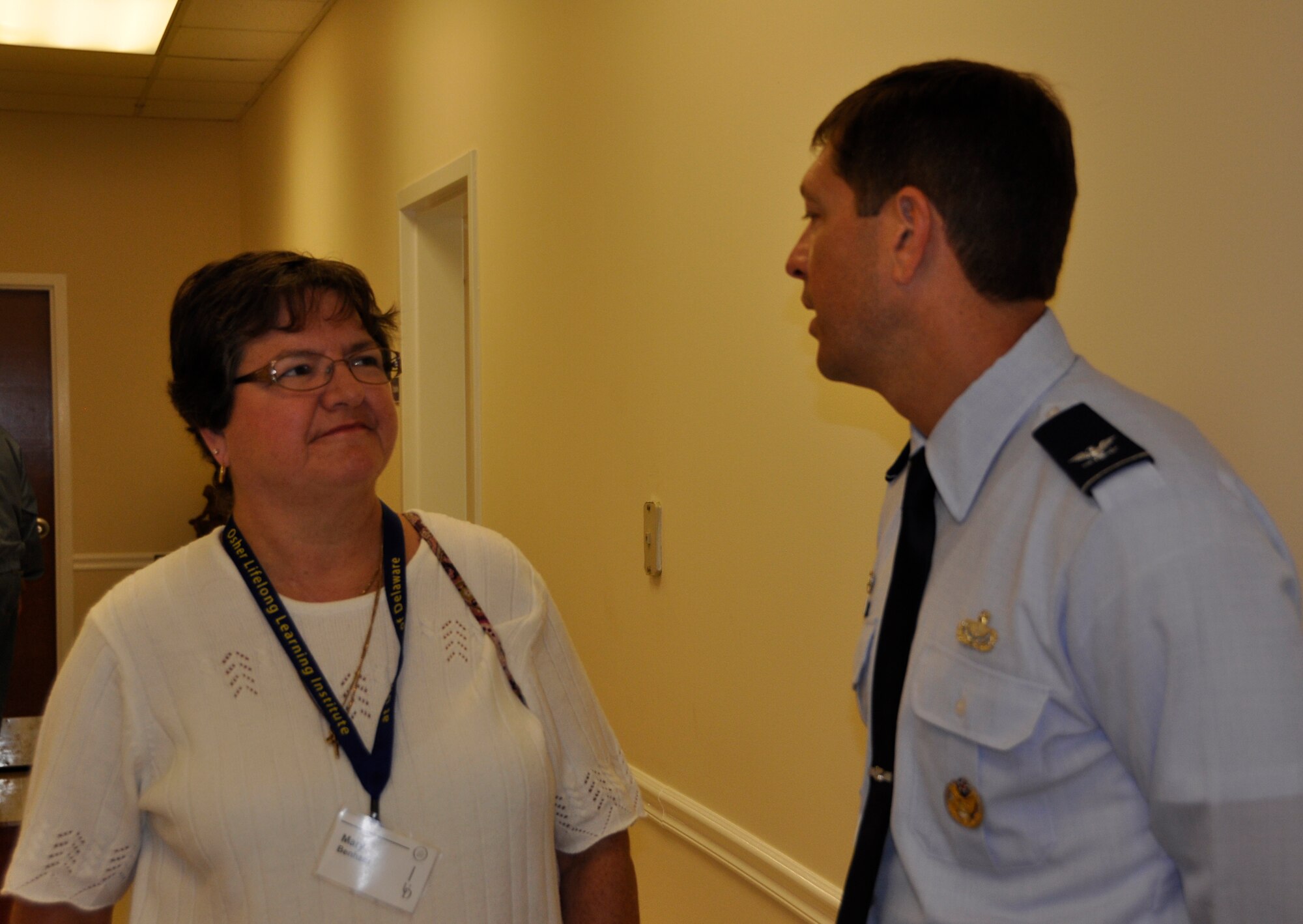 Mary Benham, a student with the University of Delaware’s Osher Lifelong Learning Institute, talks with Air Force Mortuary Affairs Operations Commander Col. Thomas C. Joyce at the Modern Maturity Center in Dover, Del., Oct. 26, 2011. Joyce was a guest speaker for their Current Events Speaker Series. (U.S. Air Force photo/Christin Michaud)