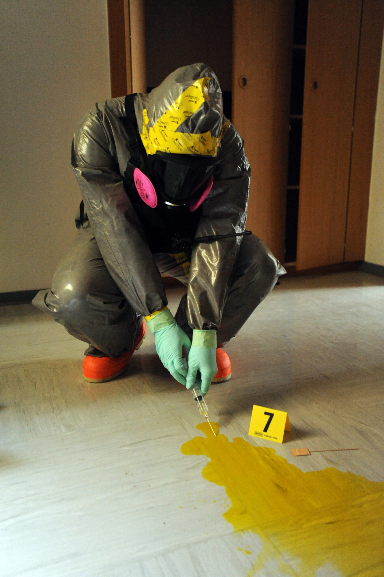 Air Force Senior Airman Jeremy Hickson, 886th Civil Engineering Squadron,
emergency management, tests samples to determine hazardous contents during a joint agency response exercise, Ramstein Air Base, Germany, Oct. 27, 2011. The exercise, designed to educate and train U.S. Air Force and Army servicemembers from six emergency response agencies, provided the skills needed for a real world response.  (U.S. Air Force by Airman 1st Class Caitlin O'Neil-McKeown)
