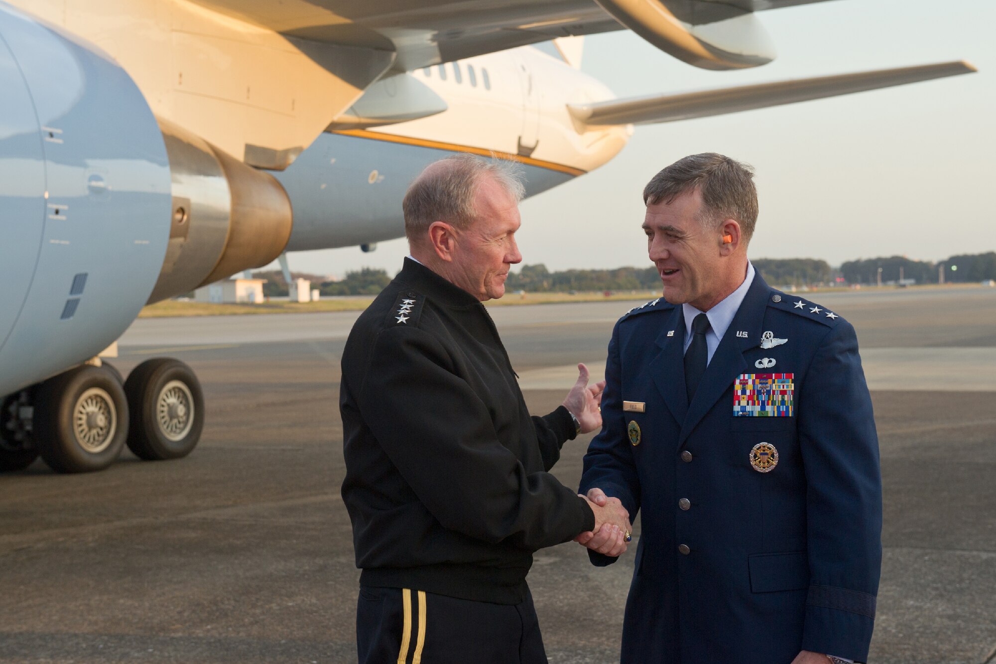 YOKOTA AIR BASE, Japan -- Lt. Gen. Burton Field (right), U.S. Forces, Japan, and 5th Air Force commander, greets Army Gen. Martin Dempsey, Chairman of the Joint Chiefs of Staff, upon his arrival at Yokota Air Base, Japan, Oct. 28, 2011. This is Dempsey's first visit to Yokota since he was sworn in as the 18th Chairman of the Joint Chiefs of Staff on Oct. 1, 2011. (U.S. Air Force photo/Osakabe Yasuo)