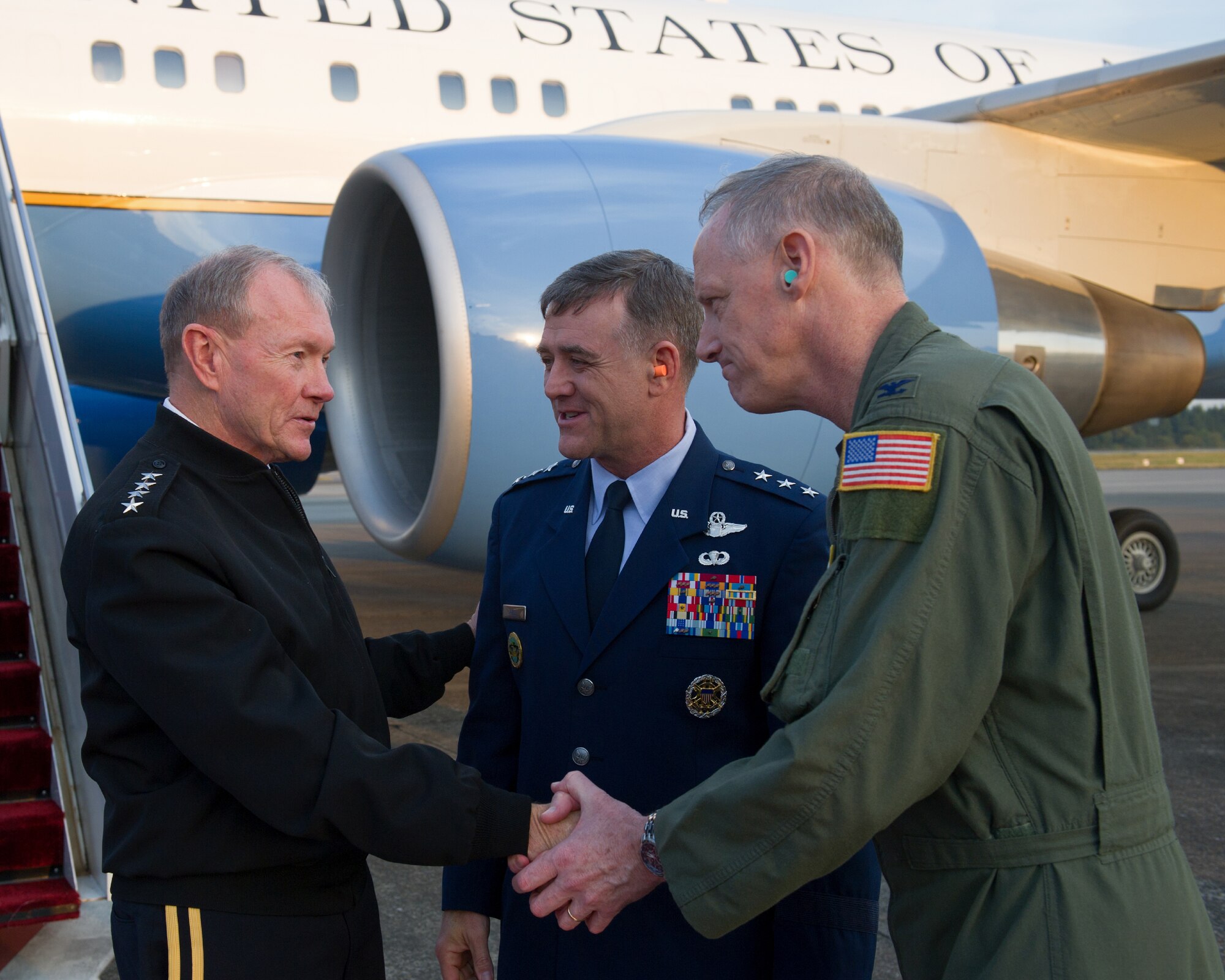 YOKOTA AIR BASE, Japan -- U.S. Air Force Lt. Gen. Burton Field (center) and Col. Otto Feather (right) greet U.S. Army Gen. Martin Dempsey (left), Chairman of the Joint Chiefs of Staff, upon his arrival at Yokota Air Base, Japan, Oct. 28, 2011. Field is the commander of U. S. Forces, Japan, and 5th Air Force and Feather is the commander of the 374th Airlift Wing. This is Dempsey's first visit to Yokota since he was sworn in as the 18th Chairman of the Joint Chiefs of Staff on Oct. 1, 2011. (U.S. Air Force photo/Osakabe Yasuo)