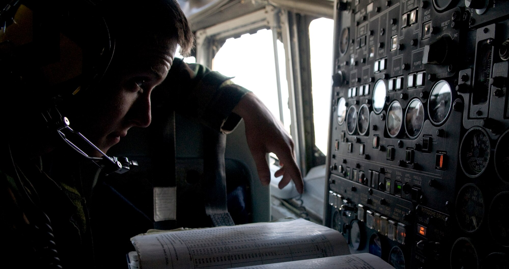 U.S. Air Force Airman 1st Class James Black, 718th Aircraft Maintenance Squadron assistant dedicated crew chief, monitors fuel gauges during the refueling of a U.S. Air Force E-3 Sentry surveillance aircraft as part of Beverly High 12-1, a local operational readiness exercise on Kadena Air Base, Japan, Oct. 27. LOREs test Airmen's abilities in a multitude of scenarios ranging from chemical attacks to self-aid and buddy care. (U.S. Air Force photo/Airman 1st Class Maeson L. Elleman/released)
