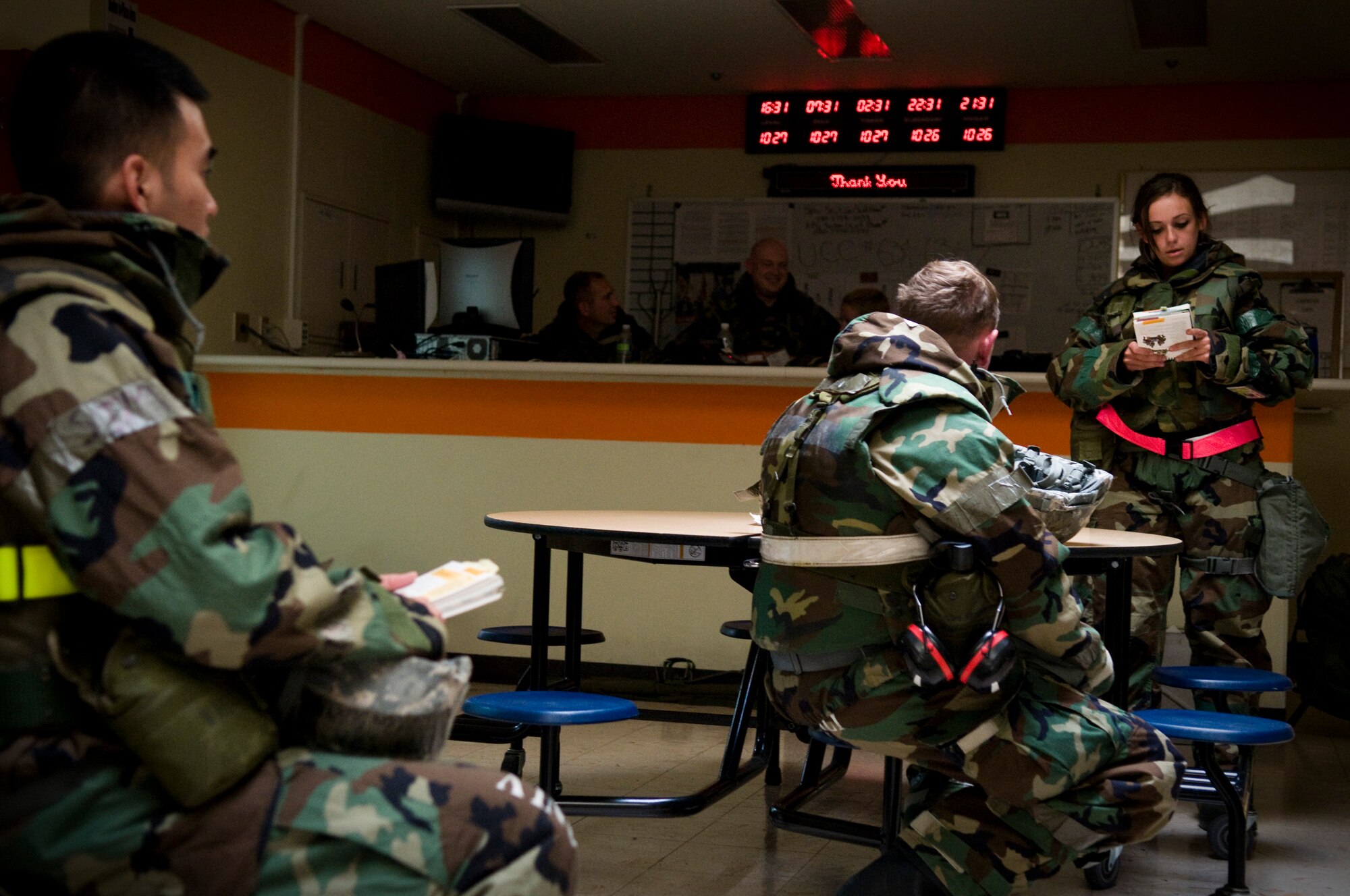 U.S. Air Force Senior Airman Shannon Harter, 718th Aircraft Maintenance Squadron material management journeyman, briefs the squadron on a section from her Airman's Manual during Beverly High 12-1, a local operational readiness exercise on Kadena Air Base, Japan, Oct. 27. The manuals become useful tools for Airmen by providing combat information and techniques from pre- to post-attack. (U.S. Air Force photo/Airman 1st Class Maeson L. Elleman/released) 