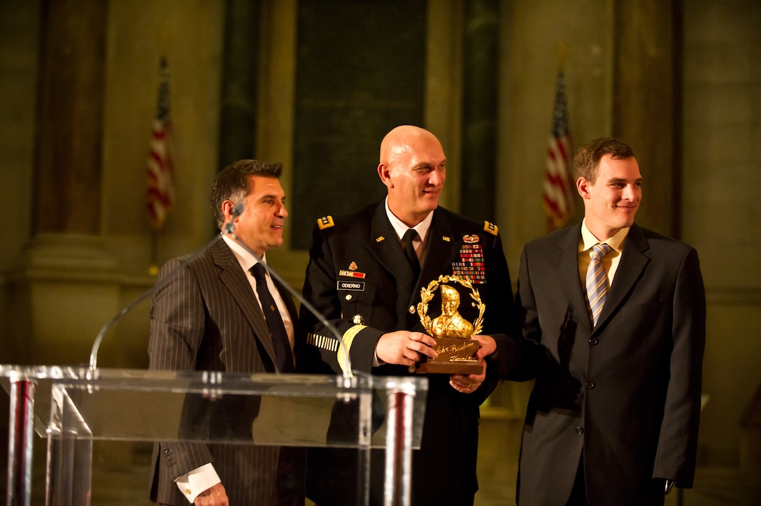Army Chief of Staff Gen. Raymond T. Odierno, center, and his son, retired Army Capt. Anthony K. Odierno, right, receive the National Italian American Foundation’s first Marine Gunnery Sergeant John Basilone Award for Distinguished Military Service from Vincent Viola at the National Archives in Washington, D.C., Oct. 27, 2011. U.S. Army photo by Staff Sgt. Teddy Wade