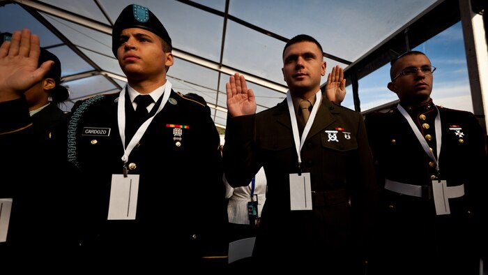 LIBERTY ISLAND, N.Y.  -- Lance Cpl. Tomas Roginski was one of a few Marines, sailors, airmen, Coast Guardsmen and soldiers to join a group of 125 immigrants in receiving their citizenship on Liberty Island, here, Oct. 28. The event was part of the day-long celebration of the 125th anniversary of the Statue of Liberty's dedication. The Department of Homeland Security rewards immigrants who join the military and serve honorably by exempting them from the normal residency requirements. Secretary of the Interior Ken Salazar told the new citizens, "You are represent what is best about America, because you represent what Americans should be celebrating and standing for around the world. We are a nation of diversity, and that diversity strengthens our country." Roginski immigrated to Brooklyn from Poland when he was a child. He currently serves in the Marine Corps with 6th Communication Battalion and is pursuing a degree in electrical engineering from the College of Staten Island. (Marine Corps production by Sgt. Randall. A. Clinton / RELEASED)