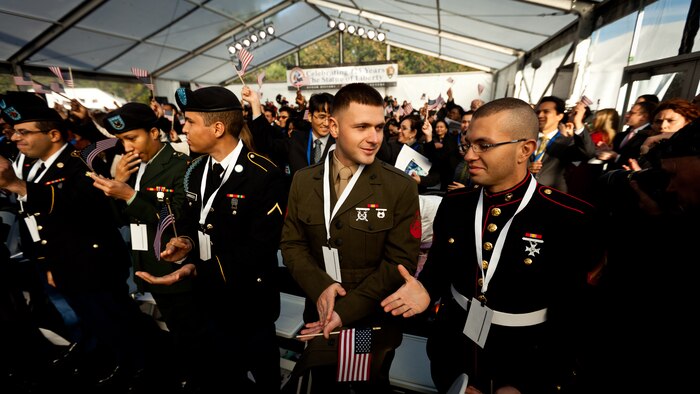 LIBERTY ISLAND, N.Y.  -- Lance Cpl. Tomas Roginski was one of a few Marines, sailors, airmen, Coast Guardsmen and soldiers to join a group of 125 immigrants in receiving their citizenship on Liberty Island, here, Oct. 28. The event was part of the day-long celebration of the 125th anniversary of the Statue of Liberty's dedication. The Department of Homeland Security rewards immigrants who join the military and serve honorably by exempting them from the normal residency requirements. Secretary of the Interior Ken Salazar told the new citizens, "You are represent what is best about America, because you represent what Americans should be celebrating and standing for around the world. We are a nation of diversity, and that diversity strengthens our country." Roginski immigrated to Brooklyn from Poland when he was a child. He currently serves in the Marine Corps with 6th Communication Battalion and is pursuing a degree in electrical engineering from the College of Staten Island. (Marine Corps production by Sgt. Randall. A. Clinton / RELEASED)