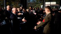 LIBERTY ISLAND, N.Y.  -- Lance Cpl. Tomas Roginski reaches out to shake the hand of U.S. Citizenship and Immigration Services director Alejandro Mayorkas at the conclusion of his naturalization ceremony, here, Oct. 28. Roginski was one of a few Marines, sailors, airmen, Coast Guardsmen and soldiers to join the naturalization ceremony with the group. The event was part of the day-long celebration of the 125th anniversary of the Statue of Liberty's dedication. The Department of Homeland Security rewards immigrants who join the military and serve honorably by exempting them from the normal residency requirements. Salazar told the new citizens, "You are represent what is best about America, because you represent what Americans should be celebrating and standing for around the world. We are a nation of diversity, and that diversity strengthens our country." Roginski immigrated to Brooklyn from Poland when he was a child. He currently serves in the Marine Corps with 6th Communication Battalion and is pursuing a degree in electrical engineering from the College of Staten Island. (Marine Corps production by Sgt. Randall. A. Clinton / RELEASED)
