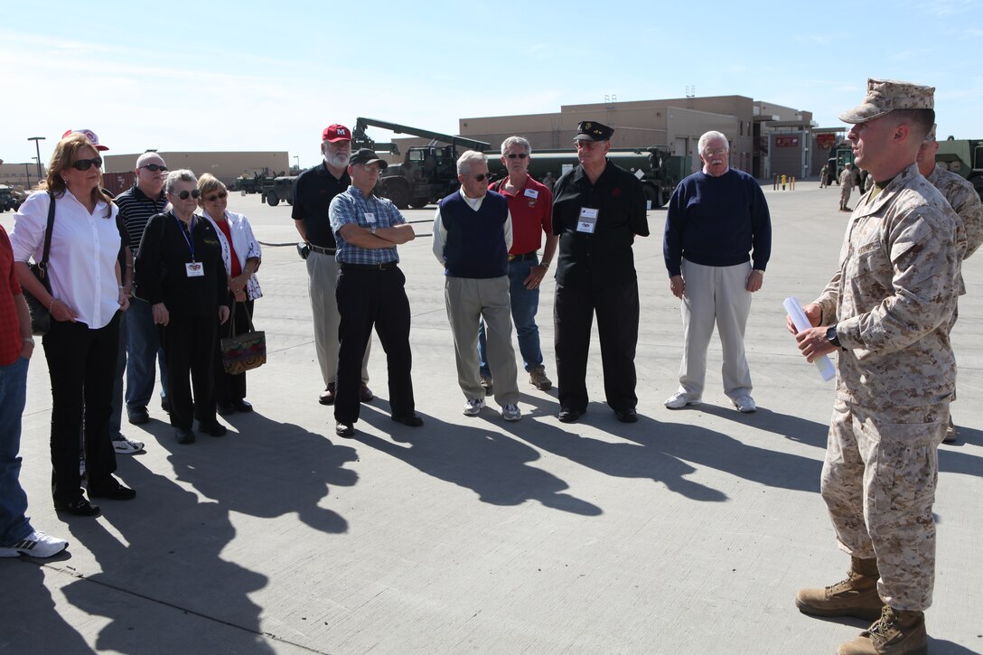 1st Lt. Timothy J. Harvey, right, the engineer company commander with Marine Wing Support Squadron 373 and a Blackstone, Mass., native, speaks to members of the Marine Corps Engineer Association during a tour of the squadron’s facility aboard Marine Corps Air Station Miramar, Calif., Oct. 28. The MCEA awarded MWSS-373 the title Engineer Company of the Year for fiscal year 2010. Thirty members of the association traveled to Miramar to learn how MWSS-373 supports 3rd Marine Aircraft Wing.
