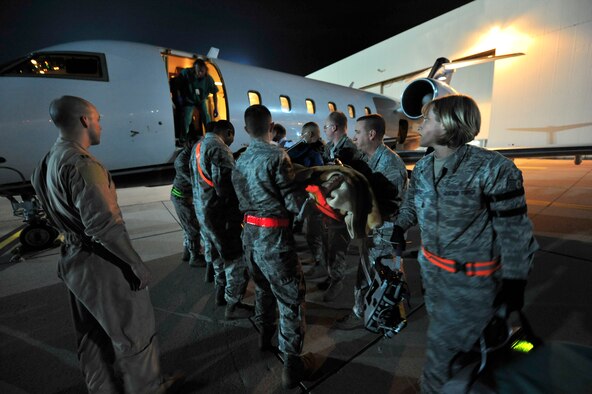 Airmen from the 86th Aeromedical Evacuation Squadron and a Critical Care Air Transport Team from Landstuhl Regional Medical Center, load a wounded Libyan fighter onto a civilian aircraft for transport to a local German hospital, Oct. 29, 2011, Ramstein Air Base, Germany. At the request of the Department of State and directed by the Secretary of Defense, USAFRICOM is supporting U.S. and international humanitarian relief efforts in Libya. Specifically, the U.S. military transported four wounded Libyans for treatment in medical facilities in Europe and 28 to the United States.  (U.S. Air Force Photo by Tech. Sgt. Chenzira Mallory)