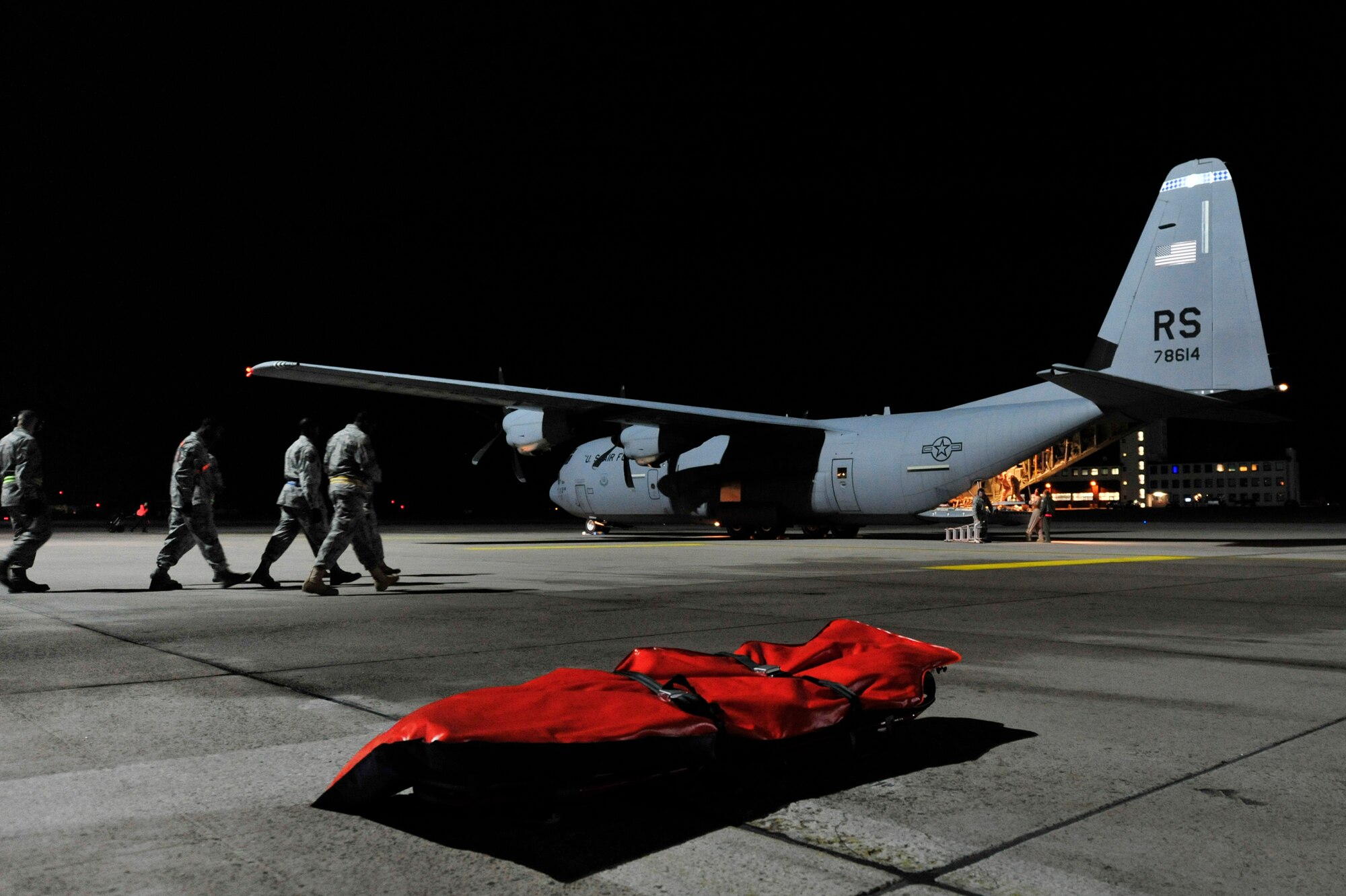 Airmen from the 86th Aeromedical Evacuation Squadron and a Critical Care Air Transport Team from Landstuhl Regional Medical Center prepare to unload wounded Libyan fighters from a C-130J Hercules, Oct. 29, 2011, Ramstein Air Base, Germany. At the request of the Department of State and directed by the Secretary of Defense, USAFRICOM is supporting U.S. and international humanitarian relief efforts in Libya. Specifically, the U.S. military transported four wounded Libyans for treatment in medical facilities in Europe and 28 to the United States.  (U.S. Air Force Photo by Tech. Sgt. Chenzira Mallory)