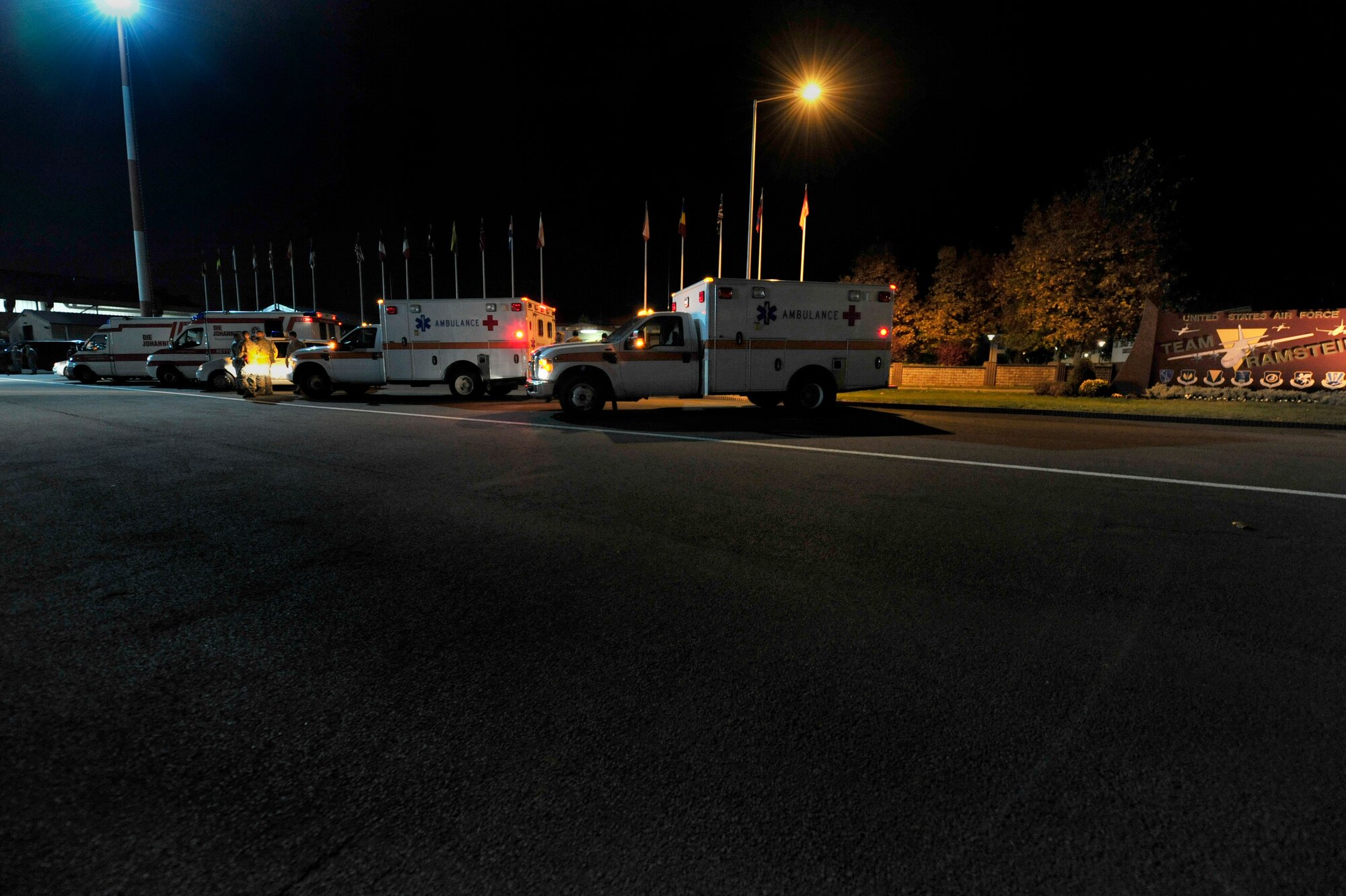 Ambulances from the 86th Airlift Wing and local German hospitals stand ready to unload wounded Libyan fighters from a C-130J Hercules, Oct. 29, 2011, Ramstein Air Base, Germany. At the request of the Department of State and directed by the Secretary of Defense, USAFRICOM is supporting U.S. and international humanitarian relief efforts in Libya. Specifically, the U.S. military transported four wounded Libyans for treatment in medical facilities in Europe and 28 to the United States.  (U.S. Air Force Photo by Tech. Sgt. Chenzira Mallory)