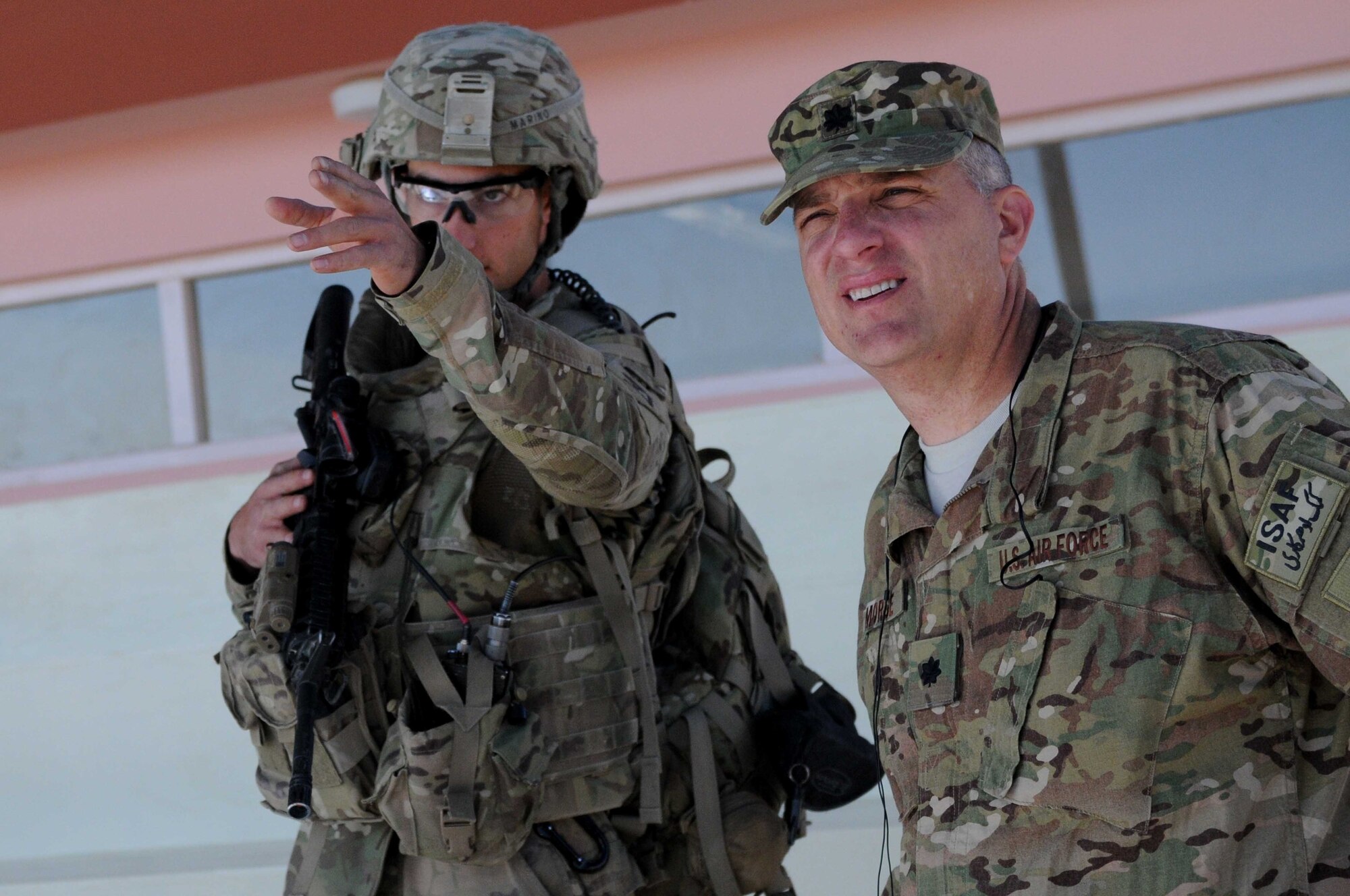 U.S. Army 1st Lt. Colin Marino (left), Provincial Reconstruction Team Paktya Security Forces platoon leader from Long Valley NJ, discusses security with Lt. Col. John Morse, inbound PRT Paktya commander from Tucson Ariz., during their pre-deployment site survey in Paktya Province, Afghanistan, Oct. 19, 2011. During their week in the province, incoming and current leadership attended shuras, facility openings and visited provincial districts. (U.S. Air Force photo/1st Lt. Cammie Quinn)