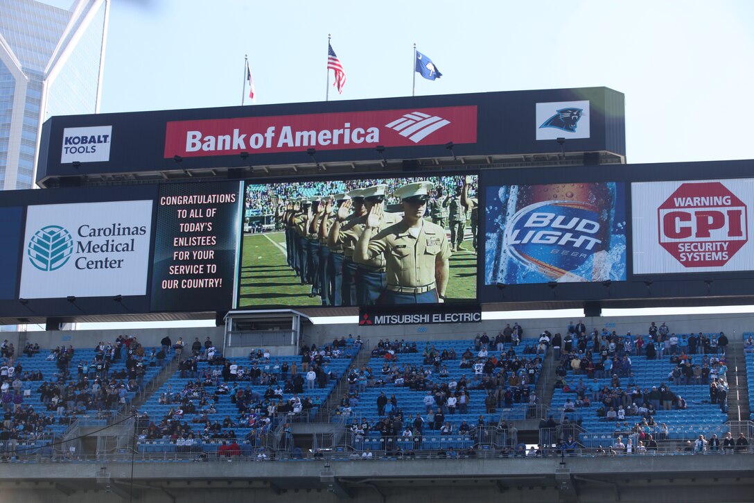 More than 50 service members across North Carolina, including five from Marine Corps Base Camp Lejeune, South Carolina and a group of soldiers in Afghanistan through a live satellite feed, reenlist for at least another four years Oct. 30 at the Minnesota Vikings vs. Carolina Panthers National Football League Military Appreciation Day game at Bank of America Stadium in Charlotte, N.C.