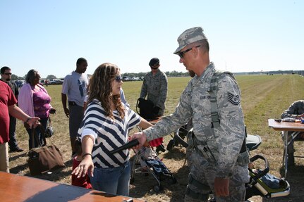 902nd Security Forces Squadron provides security for the Randolph Airshow Oct. 30. A crowd of 150,000 attended this years air show. Air shows allow the Air Force to display the capabilities of their aircraft to the American public through aerial demonstrations and static displays. Randolph's air show allows attendees to get up close and personal to see some of the equipment and aircraft used by the U.S. military servicemembers and DoD civilians today. (U.S. Air Force photo/Dan Solis) (released) (U.S. Air Force photo/Dan Solis) (released)