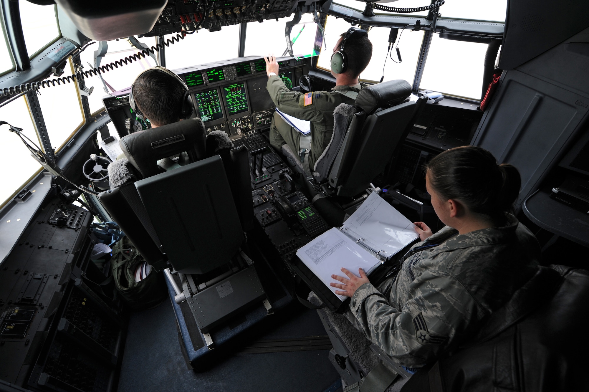 Aircrew assigned to the 37th Airlift Squadron perform preflight checklists in a C-130J Super Hercules before takeoff Oct. 29, 2011, Ramstein Air Base, Germany. The C-130J was taking blankets, cots and tents flown to Turkey as humanitarian aid for the victims of a major earthquake that occurred in north-eastern Turkey recently.