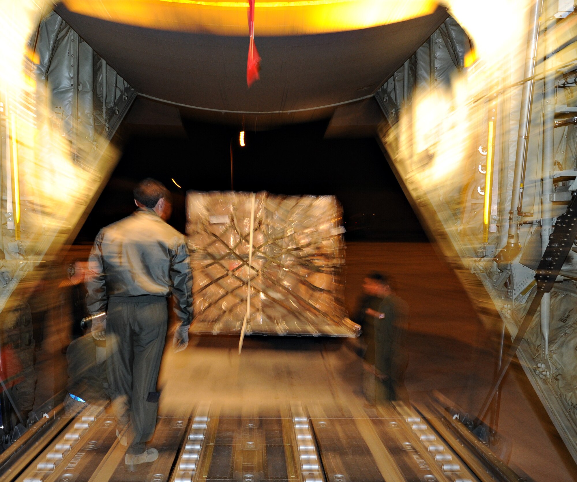 A forklift offloads supplies from a C-130J Super Hercules assigned to the 37th Airlift Squadron, Oct. 29, 2011, at Erzurum Airport, Turkey. The C-130J was taking blankets and cots flown as humanitarian aid for the victims of a 7.2-magnitude earthquake that occurred in northeastern Turkey recently.