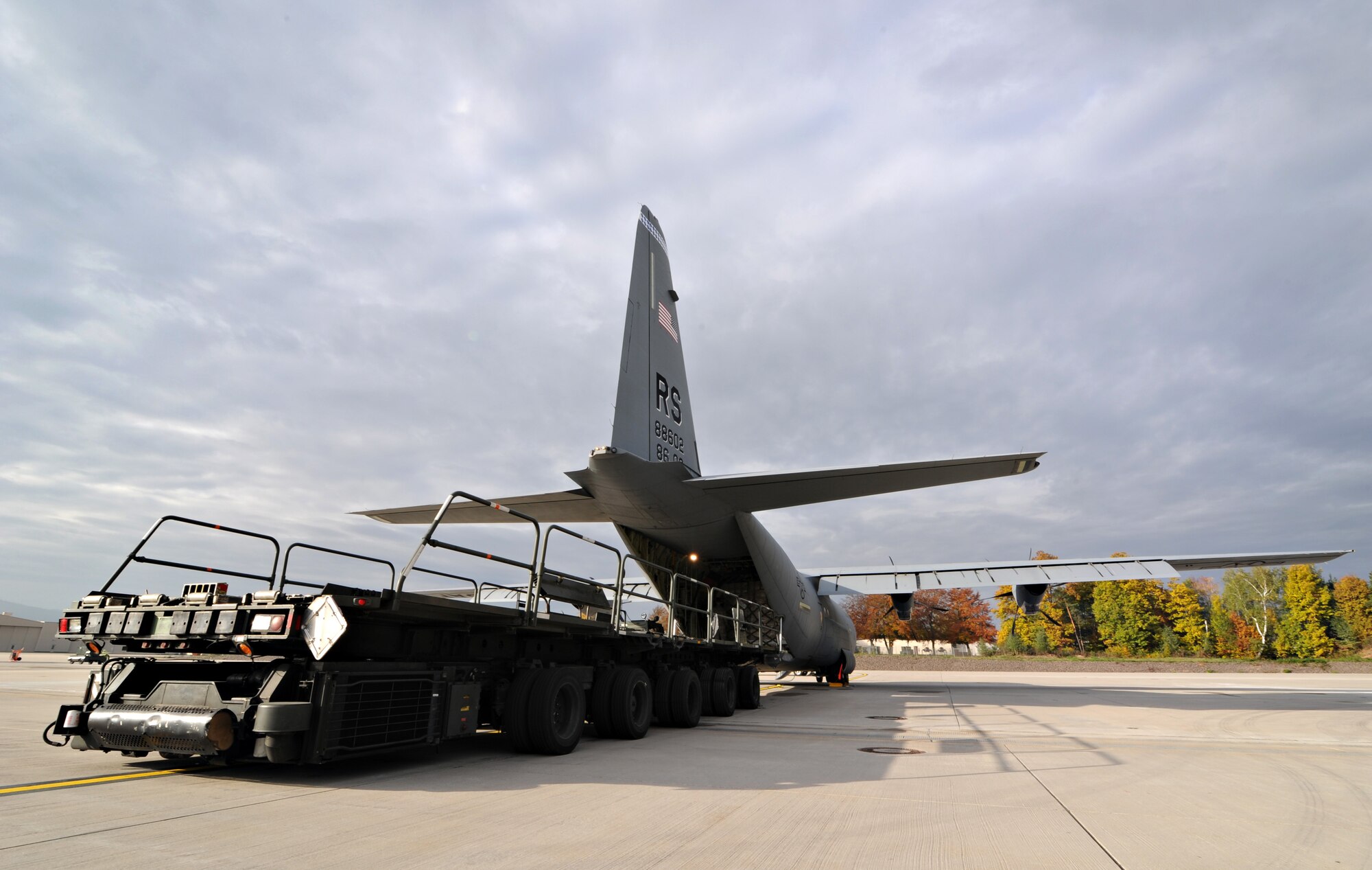 A K-loader finishes loading supplies onto a C-130J Super Hercules, assigned to the 37th Airlift Squadron, Oct. 29, 2011, Ramstein Air Base, Germany. The cargo consisted of blankets, cots and tents flown to Turkey as humanitarian aid for the victims of a major earthquake that occurred in north-eastern Turkey recently.