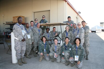 The 359th Medical Group team stands by to render aid during the Randolph Airshow Oct. 30. Air shows are an important recruiting tool for the Air Force and an opportunity for the Air Force to offer a glimpse into some of the Air Force jobs available. Events like this also showcase today's Air Force people, equipment and technology. (U.S. Air Force photo/Dan Solis) (released)