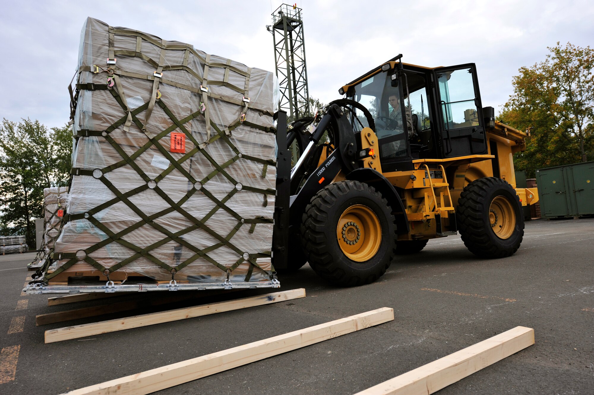RAMSTEIN AIR BASE, Germany -- Airman 1st Class Matthew Hutchinson, 721st Aerial Port Squadron, air transportation specialist, transports a pallet of humanitarian supplies Oct. 29, 2011, in support of the Turkey-led relief efforts following the Oct. 23, 2011, earthquake in Van province, Turkey. The Department of Defense has tasked U.S. European Command to airlift relief supplies to Van province at the request of the Turkish government.   (U.S. Air Force Photo by Tech. Sgt. Chenzira Mallory)