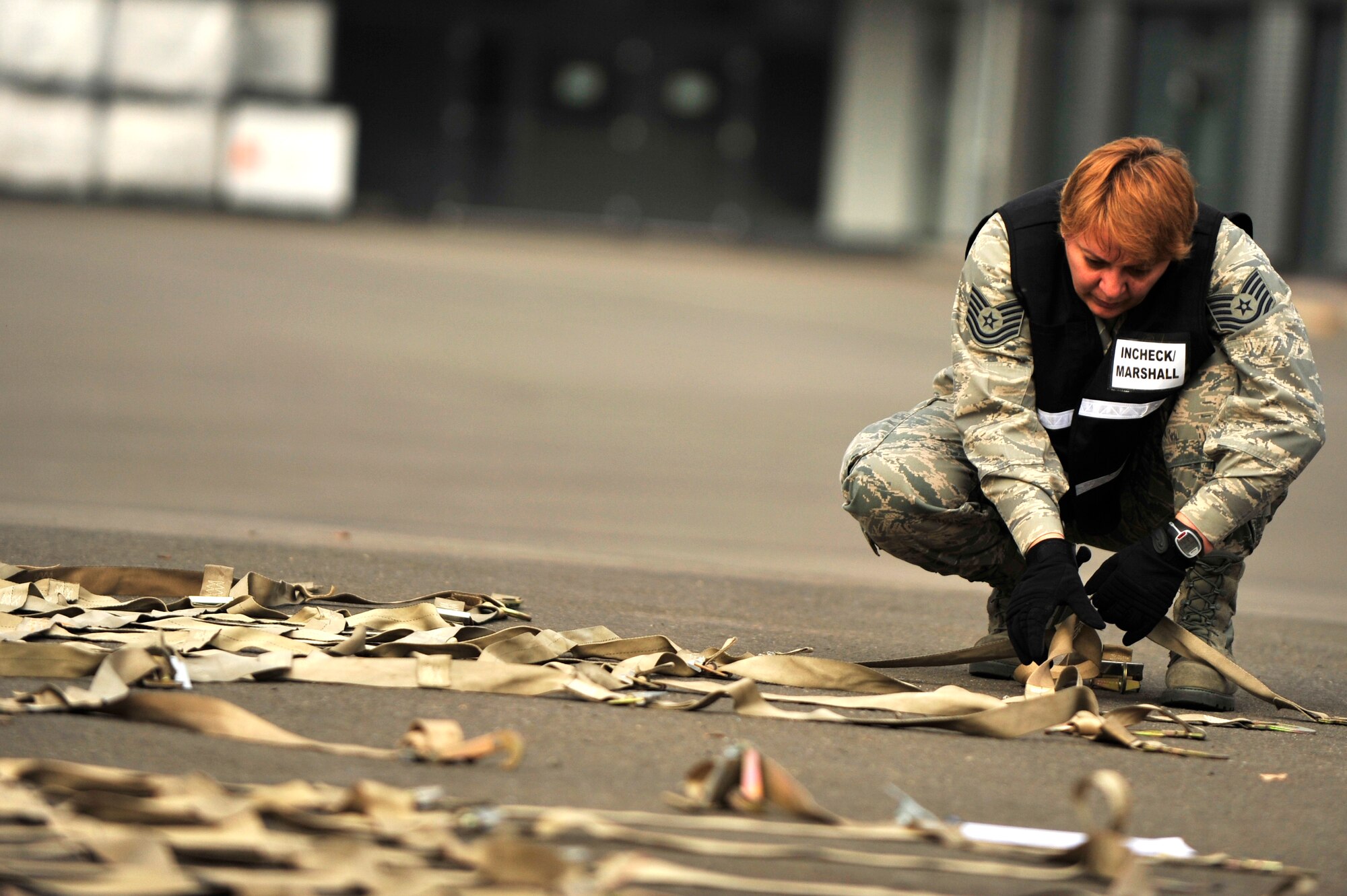 RAMSTEIN AIR BASE, Germany -- Tech. Sgt. Arleen Ledezma, 86th Logistics Readiness Squadron, NCOIC of inbound and receiving, inspects the cargo nets used for the pallets of humanitarian supplies Oct. 29, 2011, in support of the Turkey-led relief efforts following the Oct. 23, 2011, earthquake in Van province, Turkey.  The Department of Defense has tasked U.S. European Command to airlift relief supplies to Van province at the request of the Turkish government.   (U.S. Air Force Photo by Tech. Sgt. Chenzira Mallory)
