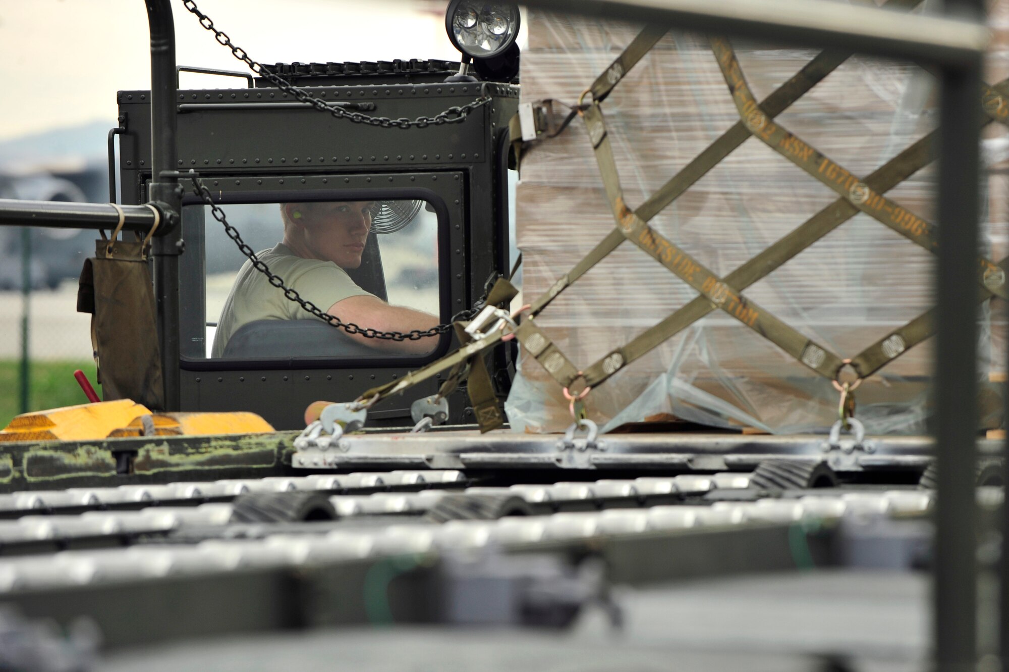 RAMSTEIN AIR BASE, Germany – Airman 1st Class John Reuter, 721st Aerial Port Squadron, air transportation specialist, loads pallets of humanitarian supplies onto a 60K loader Oct. 29, 2011, in support of the Turkey-led relief efforts following the Oct. 23, 2011, earthquake in Van province, Turkey.  The Department of Defense has tasked U.S. European Command to airlift relief supplies to Van province, Turkey at the request of the Turkish government.   (U.S. Air Force Photo by Tech. Sgt. Chenzira Mallory)

