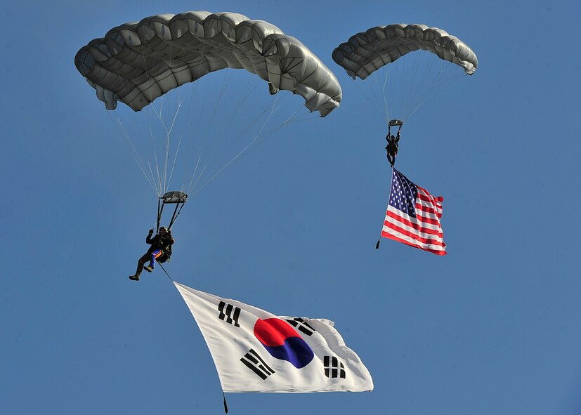 Survival, Evasion, Resistance and Escape jumpers prepare to land during the opening ceremony of Air Power Day 2011 at Osan Air Base, Republic of Korea, Oct. 30. During the air show the audience also witnessed performances by Air Combat Command's A-10 Thunderbolt II demonstration team, ROKAF's T-50 Golden Eagles and a fly-over by the Air Force's U-2 reconnaissance and surveillance aircraft. (U.S. Air Force photo/Senior Airman Adam Grant) 
