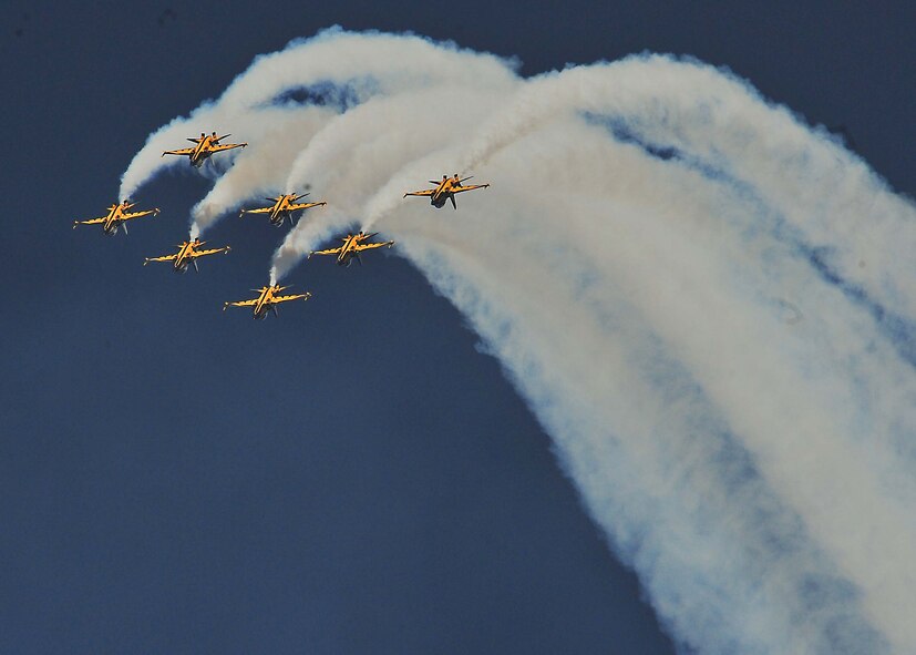 More than 50,000 service members and Korean spectators looked toward the sky and witnessed aerial stunts, jumps and performances from across the globe, at Air Power Day 2011 here, Oct. 29 and 30.  The Republic of Korea, Air Force Black Eagles perform aerial stunts in a T-50 Aircraft.  (U.S. Air Force Photo by/Staff Sgt. Daylena Gonzalez)