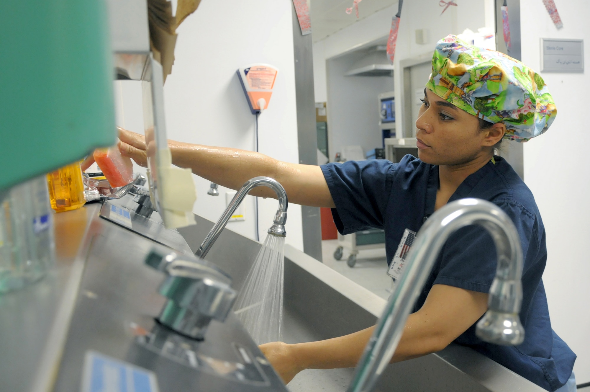 BAGRAM AIRFIELD, Afghanistan – Tech. Sgt. Latisha Shirley, 455th Expeditionary Medical Group surgical technician, washes her hands before surgery Oct. 29, 2011. Shirley is deployed from Andrews Air Force Base, M.D., and is a native of Anderson, S.C. (U.S. Air Force photo/ Senior Airman Krista Rose)