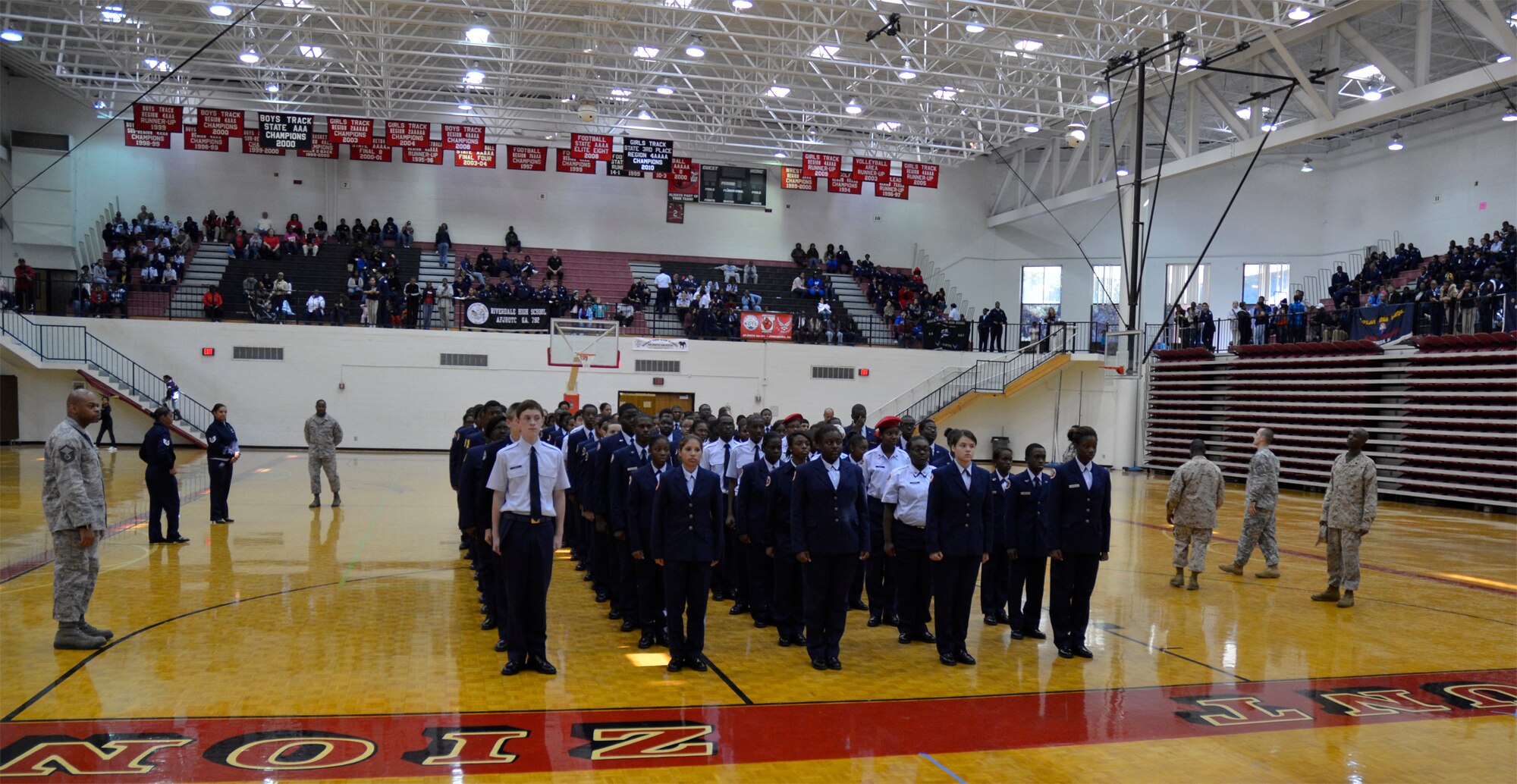 Several servicemembers, including Airmen from Dobbins, judge the final Air Force Junior Reserve Officer Training Corps competition at the Mt. Zion High School drill meet Nov. 29. The event was a "Simon-says" like game in which the JROTC cadets had to respond properly to a roll call of facing movements. (U.S. Air Force photo/ Senior Airman Danielle Campbell Purnell)