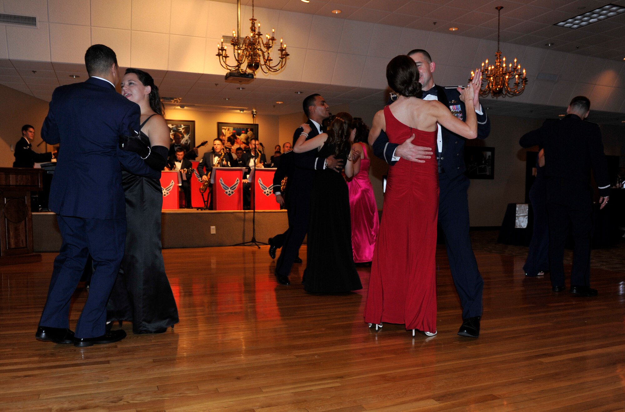 Those in attendance dance to the music during the 64th Air Force Ball, Oct. 29, at Little Rock Air Force Base, Ark.  Music from featured from the Air Force Air Mobility Command Band of Mid-America “Shades of Blue” and featured a DJ later in the night. (U.S. Air Force photo by Senior Airman Caleb Pierce)