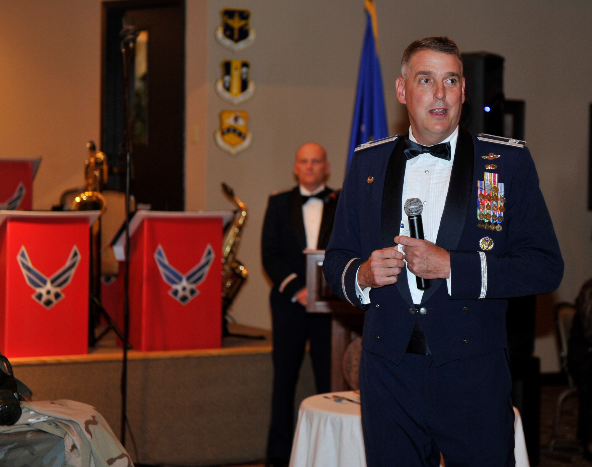 Col. Mike Minihan, 19th Airlift Wing commander, speaks to those in attendance at the 64th Air Force Ball, Oct. 29, at Little Rock Air Force Base, Ark. The event featured a red-carpet theme and lasted from 6 p.m. – 12 a.m. (U.S. Air Force photo by Senior Airman Caleb Pierce)