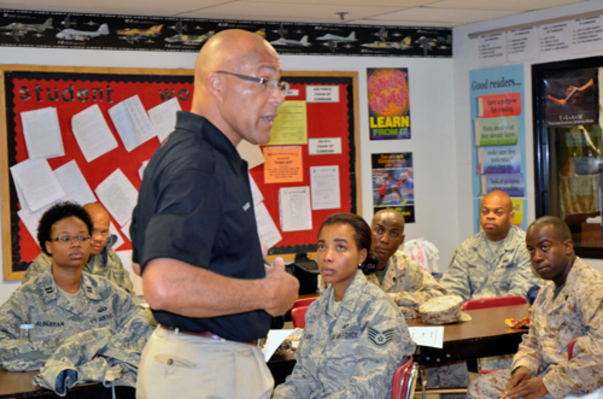 Several servicemembers, including six Airmen from Dobbins, are briefed on what to expect at the Mt. Zion High School drill competition Nov. 29.  The servicemembers volunteered their time to serve as judges during an Air Force Junior Reserve Officer Training Corps meet in Clayton County. (U.S. Air Force photo/ Senior Airman Danielle Campbell Purnell)