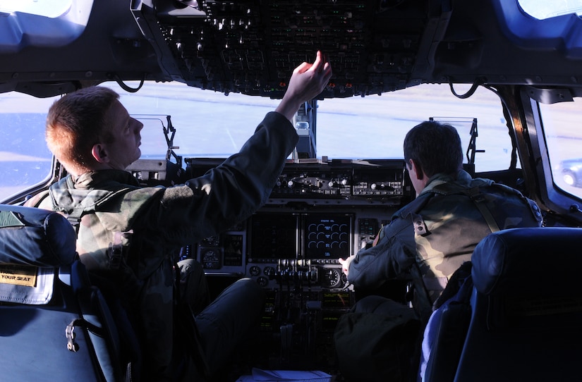 Capt. Larry Abee and Capt. Mike Chrapkiewkz follow their pre-flight inspection checklist prior to conducting a mission Oct. 27 at the Combat Readiness Training Center in Gulfport, Miss. Pre-flight inspections ensure the avionics on the aircraft are working properly and that the aircraft is prepared for flight.  More than 600 Airmen participated in this week-long exercise to prepare for Joint Base Charleston's upcoming Operational Readiness Inspection.  Abee and Chrapkiewkz are pilots from the 300th Airlift Squadron.  (U.S. Air Force photo/Senior Airman Ian Hoachlander)