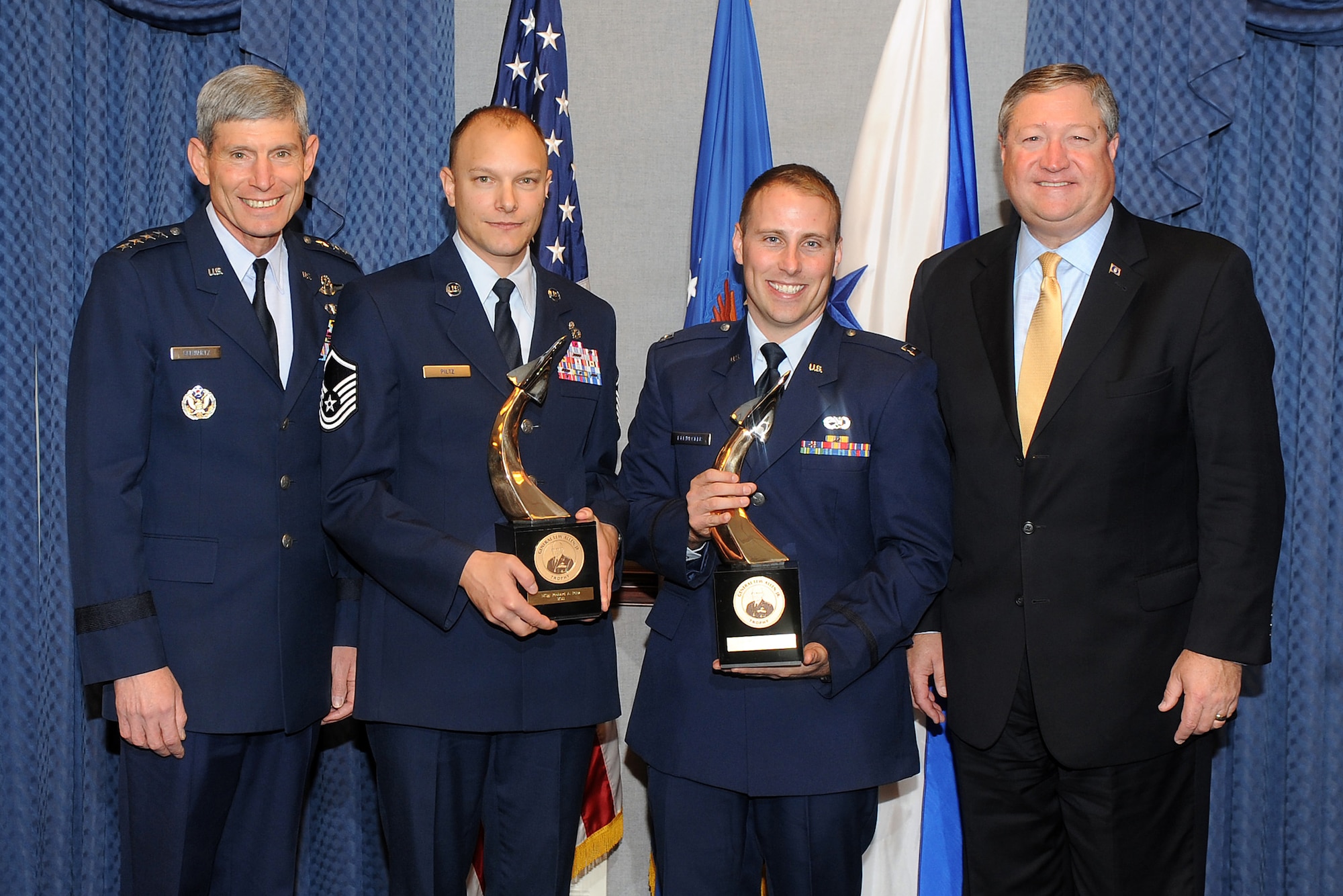 Air Force Chief of Staff Gen. Norton Schwartz and Secretary of the Air Force Michael Donley stand with Capt. William Bernecker and Master Sgt. Richard Piltz, the 2011Gen. Lew Allen Jr. Trophy recipients, during a ceremony Oct. 28, 2011, in the Pentagon. (U.S. Air Force photo/Andy Morataya)