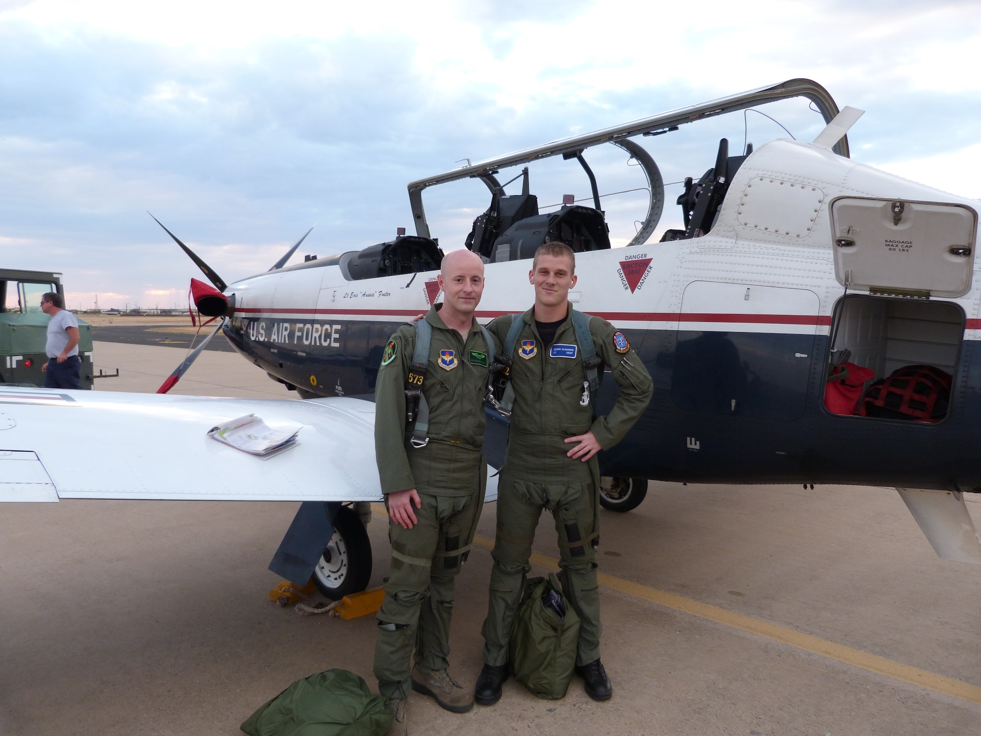 Capt. Frank Baumann, 459thFlying Training Squadron instructor pilot, and 2nd Lt. Derek Olivares, Euro-NATO Joint Jet Pilot Training student pilot, pose for a photo after expertly landing the stricken T-6 Texan II aircraft on Sept. 13. 