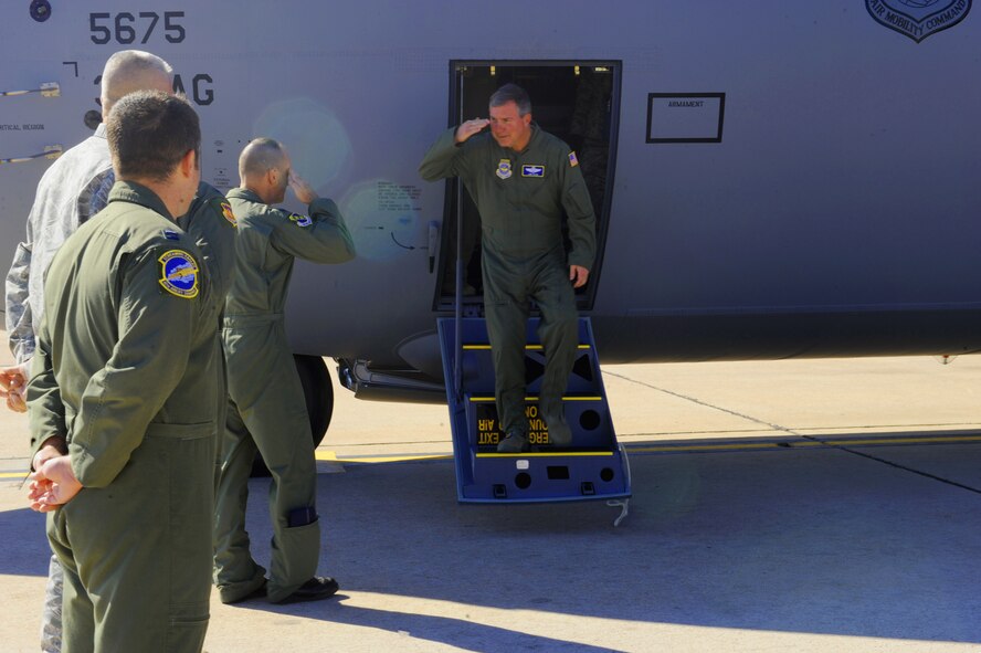 Col. David Béen, 7th Bomb Wing commander, salutes Brig. Gen. Jon Fago, Chief of Staff, Headquarters, Nebraska Air National Guard, Lincoln, Neb., as he exits Dyess’ newly acquired aircraft Oct. 28, 2011, at Dyess Air Force Base, Texas. The aircraft is the 10th of 28 to be delivered to Dyess by 2013, replacing the current aging fleet of C-130H models. (U.S. Air Force photo by Airman 1st Class Cierra Bullock/ Released)