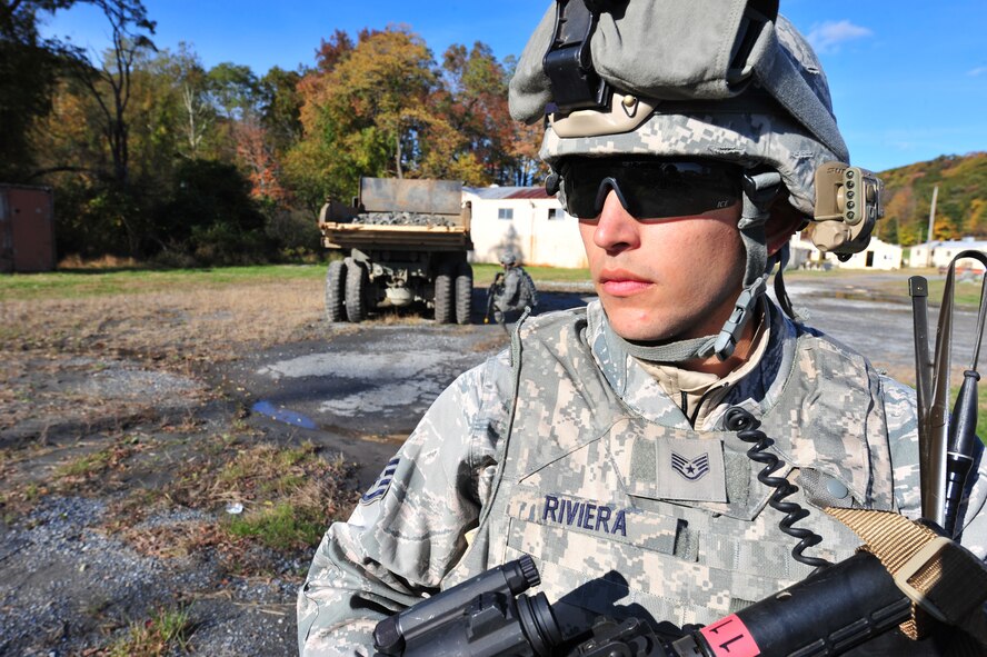 U.S. Air Force Staff Sgt. Matthew Rivera, 823rd Base Defense Squadron fire team leader, takes cover during an exercise at Camp Smith, N.Y. Oct. 28, 2011. During the exercise the Airmen had to practice everything they learned throughout the week. The Airmen from the 823rd BDS and 105th Security Forces Squadron were taught a wide veriety of training from line formations to combat lifesaver skills. (U.S. Air Force photo by Staff Sgt. Stephanie Mancha/Released)