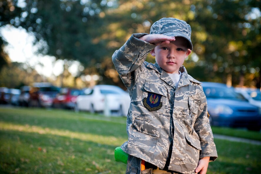 Shane, 4, salutes in his military Halloween costume during trick or treat at Moody Air Force Base, Ga., Oct. 29, 2011. Shane is the son of U.S. Air Force Staff Sgt. David Edwards of the 23rd Security Forces Squadron. This was Shane’s second Halloween at Moody. (U.S. Air Force photo by Staff Sgt. Jamal D. Sutter/Released)