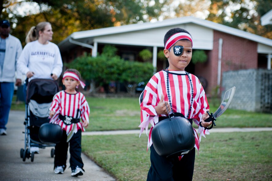 Halloween pirates Cedrick and Tyrese Kaufman make their way through base housing during trick or treat at Moody Air Force Base, Ga., Oct. 29, 2011. The boys are sons of U.S. Air Force Staff Sgt. Royce Kaufman of the 723rd Aircraft Maintenance Squadron. (U.S. Air Force photo by Staff Sgt. Jamal D. Sutter/Released)
