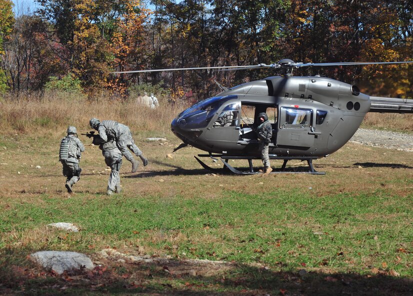 A U.S. Air Force Airman is medically evacuated after being injured by a roadside improvised explosive device that hit a Humvee during an exercise at Camp Smith, N.Y., Oct. 28, 2011. The Airmen from the 823rd Base Defense Squadron and 105th Security Forces Squadron were given real life scenarios and had to perform what they learned in the classroom training. (U.S. Air Force photo by Staff Sgt. Stephanie Mancha/Released)