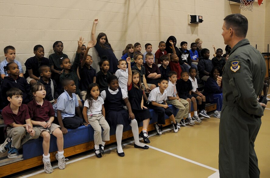Col. Thomas Hesterman, 2nd Bomb Wing vice commander, speaks with children at the Barksdale Youth Center about the dangers of drugs during the Red Ribbon Week pledge event on Barksdale Air Force Base, La., Oct. 27. Hesterman was joined by Chief Master Sgt. Larry Malcom, 2 BW command chief, Sparky the fire mascot and McGruff the crime fighting dog to take the drug-free pledge with Barksdale children. (U.S. Air Force photo/Senior Airman Amber Ashcraft)(RELEASED)