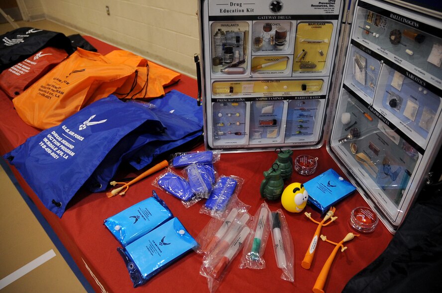 A table with examples of good and bad drugs and paraphernalia was set up for youth center children during the Red Ribbon Week pledge event on Barksdale Air Force Base, La., Oct. 27. More than 50 children took a pledge against doing drugs. Back-packs with treats were given to the children for signing the pledge. (U.S. Air Force photo/Senior Airman Amber Ashcraft)(RELEASED)