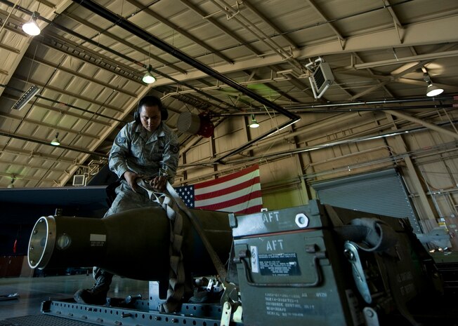 U.S. Air Force Staff Sgt. Ryan Reyes, 757th Aircraft Maintenance Squadron aircraft armament systems craftsman, ensures a 5,000 pound Guided Bomb Unit 28 (GBU-28), is properly secured on a munitions trailer Oct. 7, 2011, at Nellis Air Force Base, Nev. Sergeant Reyes is responsible for loading and unloading munitions, explosives, and propellant devices on aircraft.(U.S. Air Force photo by Staff Sgt. Christopher Hubenthal/Released)