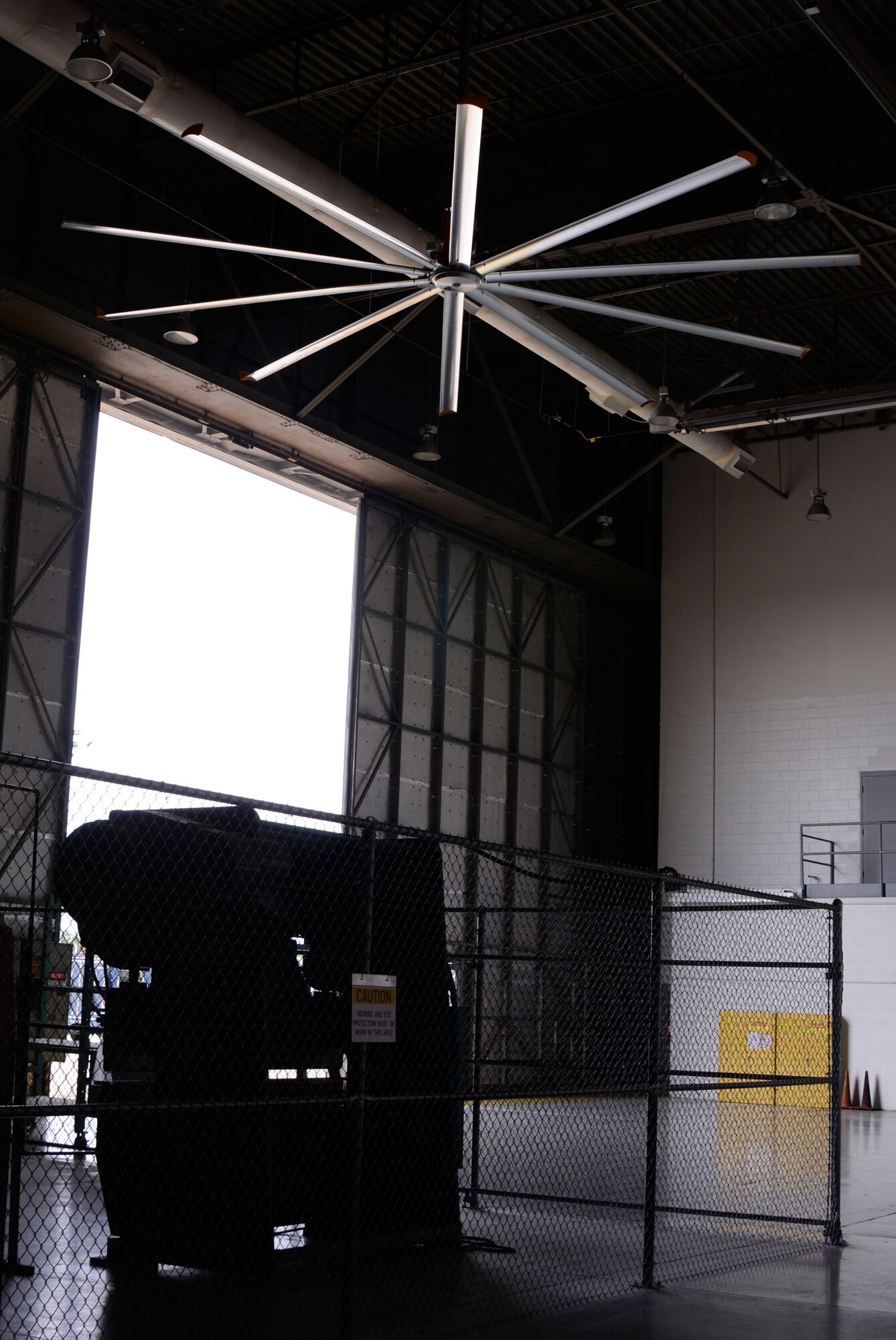 Members of the 94th Maintenance Squadron experience a climate controlled environment due to large fans installed in aircraft maintenance bays 2 and 3 in building 838 here Oct. 27. (U.S. Air Force photo/Don Peek)