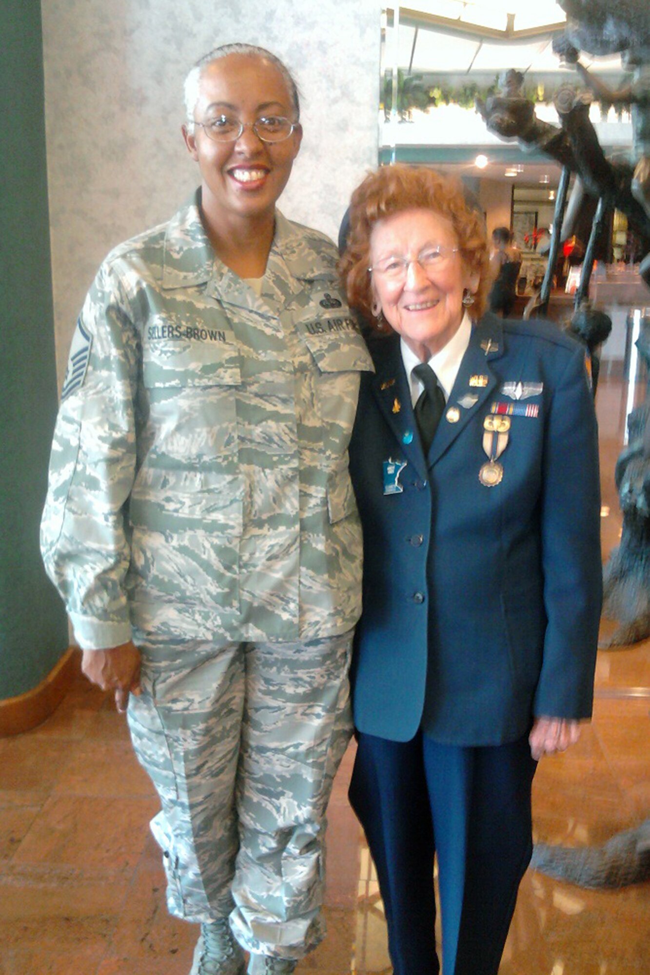 Master Sgt. Bianca Sellers-Brown, who is the noncommissioned officer in charge of the commander’s support staff for the 307th Mission Support Group, and Mrs. Elizabeth Strohfus, pose for a photo at the 2011 Commemorative Air Force Air Show in Odessa, Texas, Oct. 7, 2011. In August 1943, Strohfus, who is now 91 years old, was selected to participate in a women’s flight program freeing men pilots to report for military duty overseas. These women were officially designated as WASPs, Women Airforce Service Pilots. Sellers-Brown was selected as a military escort for Mrs. Strohfus for the air show. (Courtesy photo)
