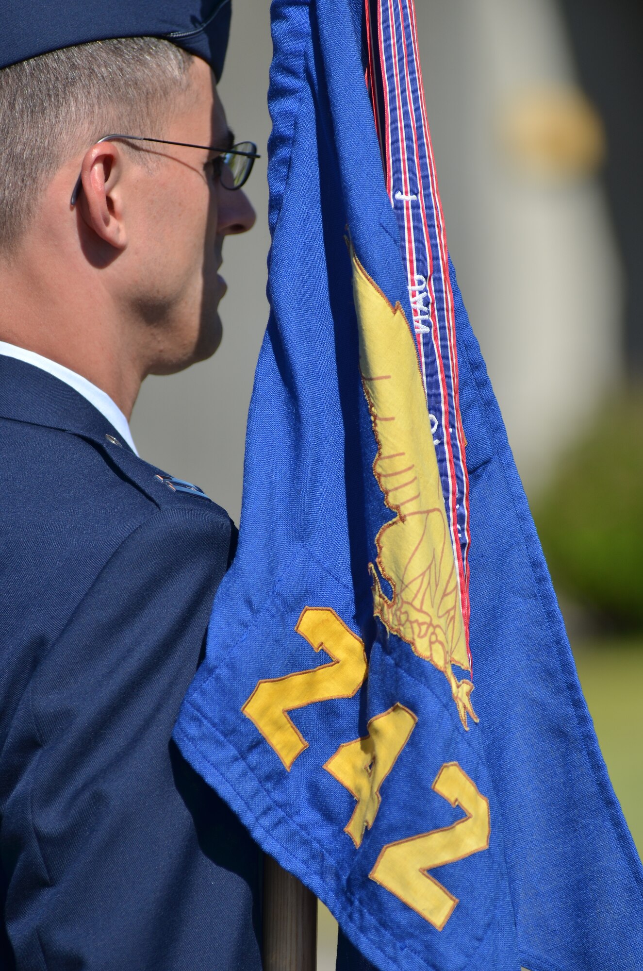 Capt. James Barnet, Cyber Operations Commander, stands tall during the lowering of the American flag.