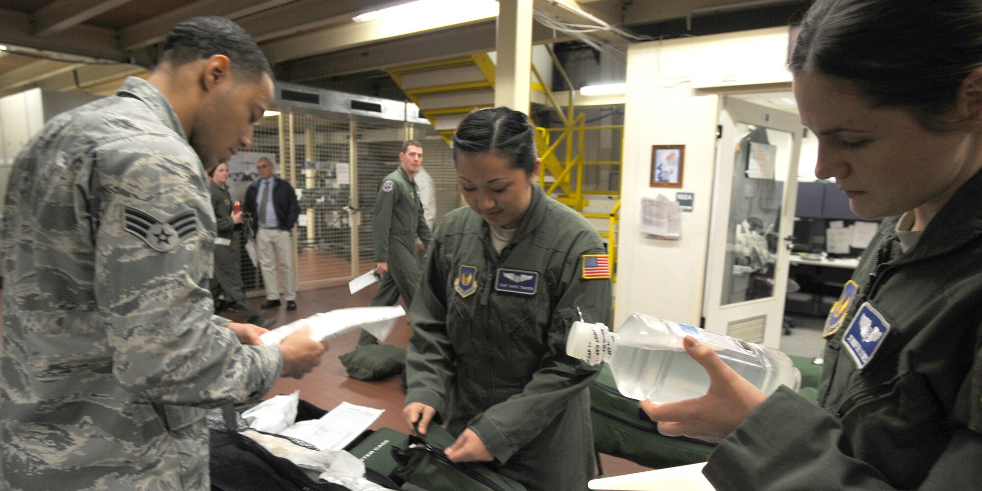 Senior Airman Benjamin Pace and Senior Airman Benjamin Pace (left), Tech. Sgt. Yayee Thayer and Capt. Jennifer Lewis of the 86th Aeromedical Evacuation Squadron at Ramstein Air Base, Germany, run through a checklist of medical supplies Oct. 28, 2011, prior to an air evacuation mission to evacuate 26 injured freedom fighters from Tripoli, Libya. Two aircraft will transport 26 seriously wounded fighters to Spaulding Rehabilitation Hospital in Boston, Mass. An additional five critical cases will be transferred to Germany for immediate care. All patients were injured as a result of recent fighting and suffer from conditions that cannot currently be treated in Libya. (U.S. Army Photo/Pvt. Richard Bartell)